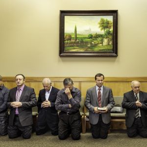 "Ministers of the Ukrainian Bible Church in Fairview, Oregon, pray before the Sunday morning service. The greater Portland area is home to many thousands of Slavic Christians.