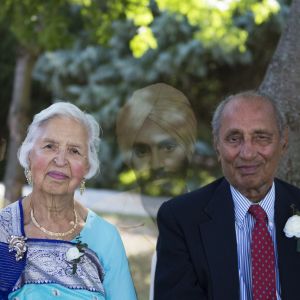 This photo depicts the photographer's mother and father — along with images of their younger selves as they looked when they first emigrated from India to the United States in 1965.